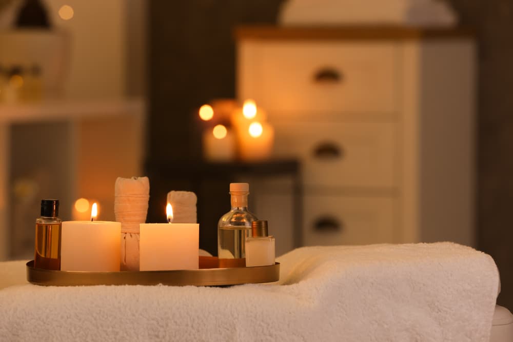 Peaceful massage room setup with candles, oils, and warm lighting for a 90-minute male sensual massage in Weston-super-Mare