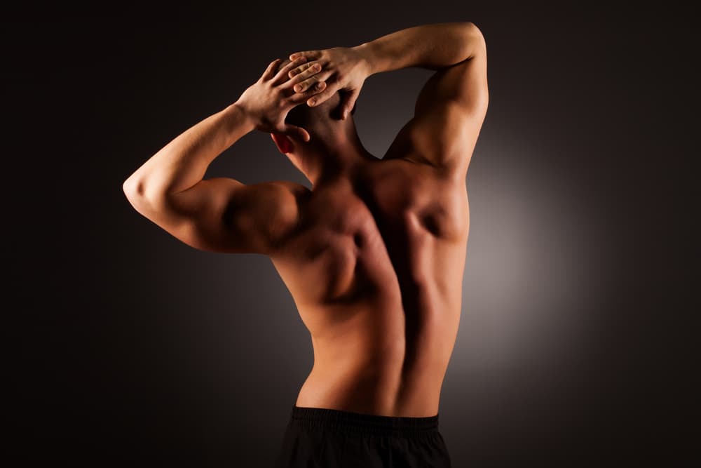 Toned man showing defined results of a professional Sienna one-hour spray tan in Weston-super-Mare